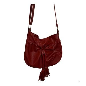 Red faux leather cross body tassel handbag
